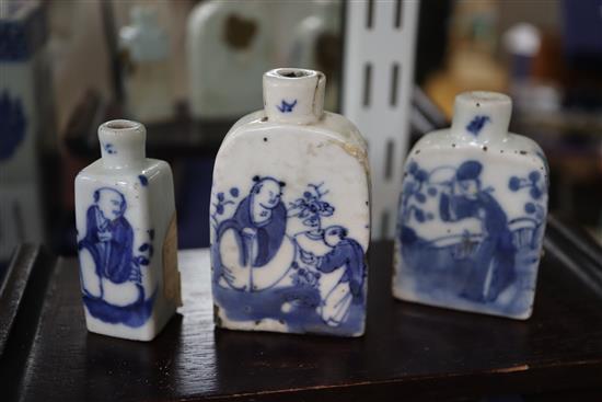 Two Chinese blue and white pillows and three similar snuff bottles, with three hardwood stands